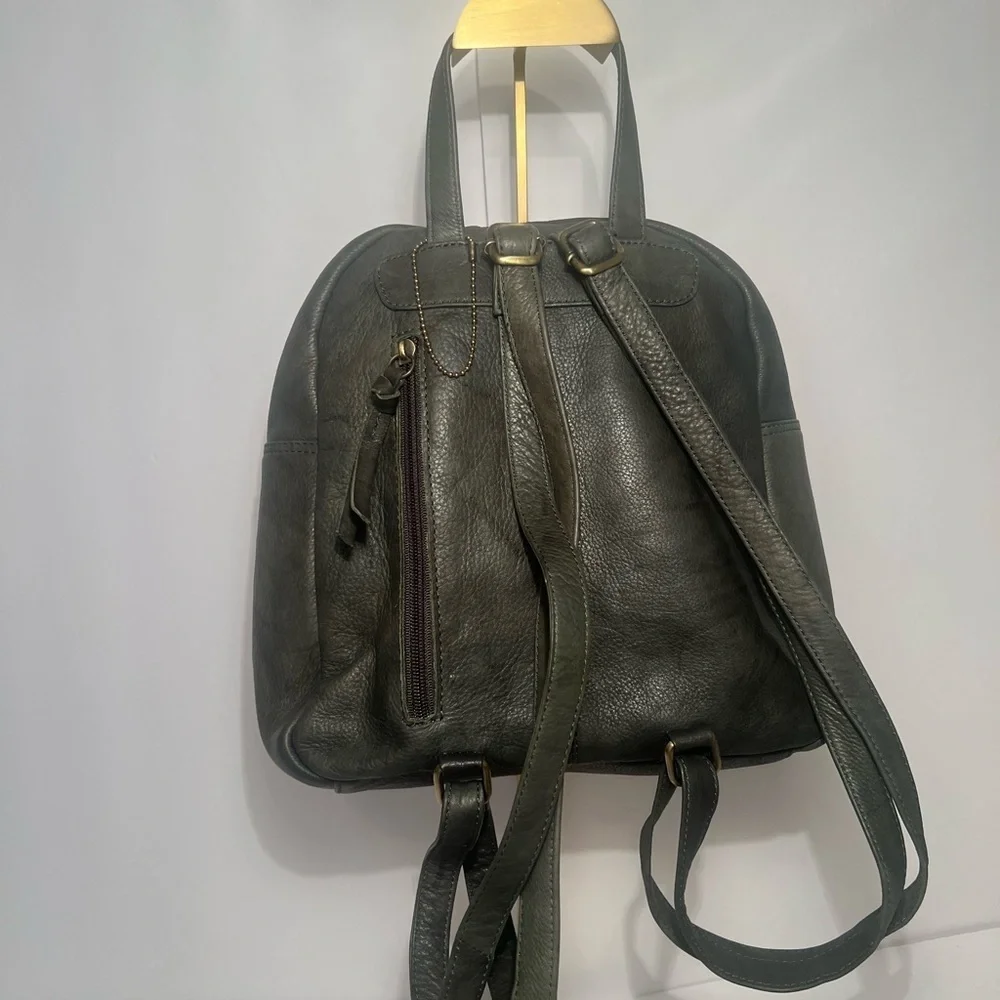 Green Backpack with Rugged Design and Leather Material